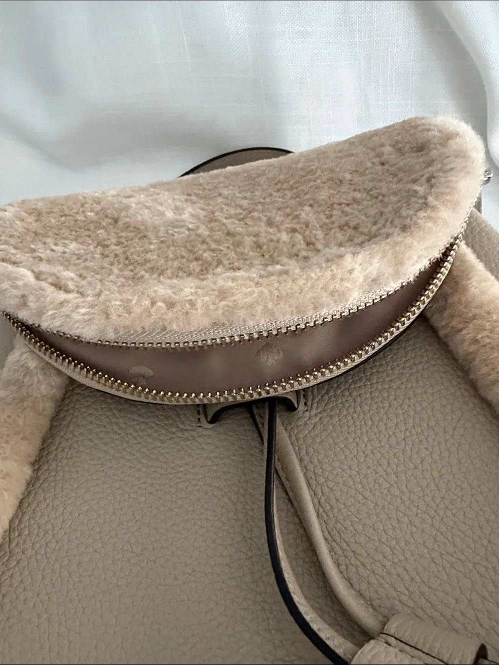 kate spade beige faux-shearling flap backpack